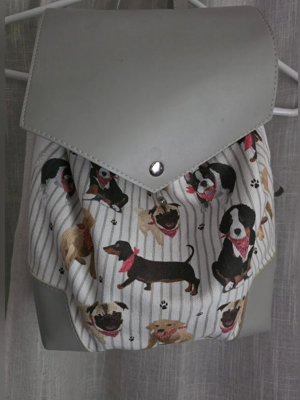 Grey and White Backpack with Playful Dog Print and Wooden Dog Brush